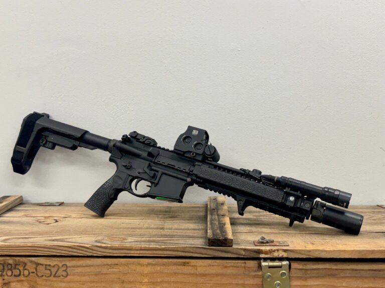 Daniel Defense DDM4, 10.3" Barrel, 5.56, Semi-automatic, Handgun, AR Maglock, Eotech EXPS3, Surefire Warden Shroud, Surefire Warcomp, Surefire Scout Light, Surefire Tape Switch, MagPul Front and Rear Iron Sights, BCM Charging Handle, SB Pistol Brace, Magpul B.A.D Lever